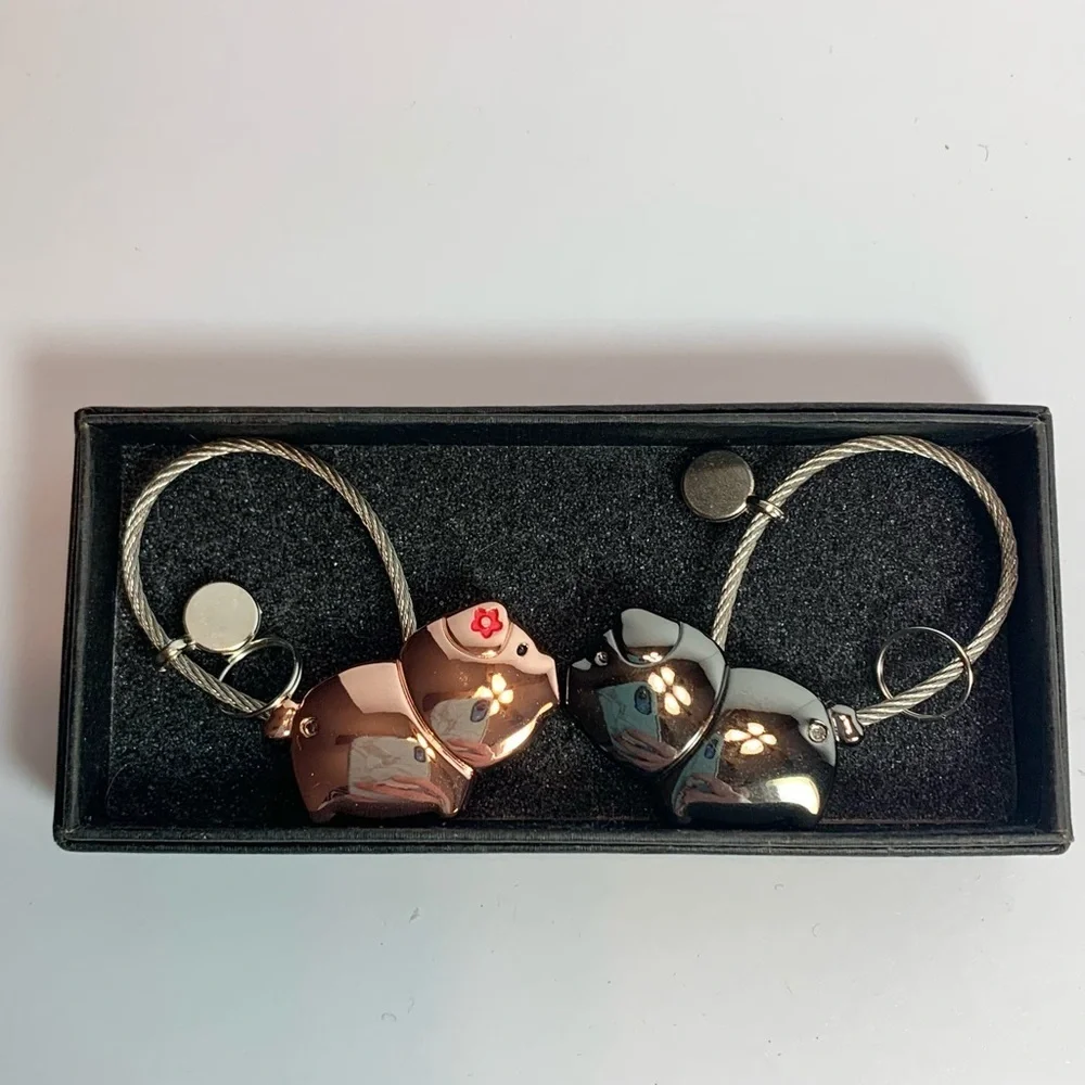 2 Charming Metal Piggies Cord Keychains